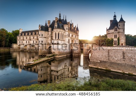 Castle chateau de Chenonceau in Loire Valley, France. It is French landmark located near small village of Chenonceaux. Scenic view of old castle on River Cher at sunset. Sightseeing and travel theme.
