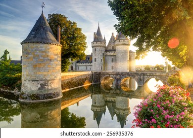 Castle Chateau De Sully-sur-Loire At Sunset, France. It Is Famous Landmark Of Loire Valley. Beautiful Sunny View Of Medieval Castle, Nice Landscape Of Old France In Summer. Sightseeing, Travel Theme 