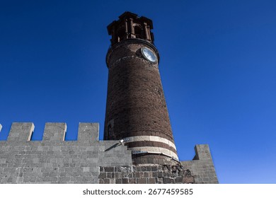A castle with a clock tower built in the old period in Erzurum