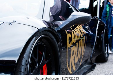 Castle Combe, Wiltshire, UK Sept 2018. Close Up Shot Side Profile Of Ferrari Spider, Isolated