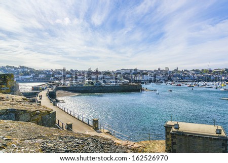 Castle Cornet has guarded Saint Peter Port and harbor for 800 years. Saint Peter Port - capital of Guernsey - British Crown dependency in English Channel off the coast of Normandy.