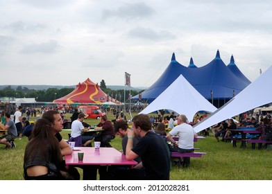 Castle Donington, East Midlands UK 06 14 2014 People Seated At An Outdoor Rock Music Festival