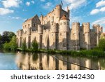 Castle Gravensteen, Ghent. Medieval castle Gravensteen (Castle of the Counts) in Ghent, Flanders, Belgium. Legendary castle with small windows surrounded by water in moat in Ghent, Flanders, Belgium.