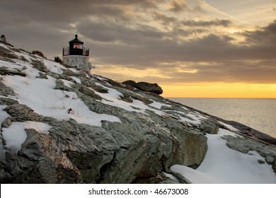 Castle Hill Lighthouse Sits In A Warm Glow At Sunset  After A Winter Storm In  New England.