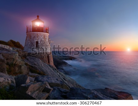 Castle Hill Lighthouse at sunset with setting sun