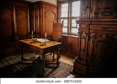Castle Interior. Cabinet With Writing Desk With A Book And Candlesticks, Room With Baroque And Renaissance Wooden Carved Furniture, Castle Bouzov, Moravia, Czech Republic, July 05, 2018