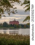 Tranekær Castle and lake at sunset, Langeland, Denmark