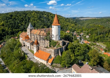 Křivoklát Castle in the middle of dense forests, Czech Republic, medieval architecture surrounded by nature and scenic landscapes.
