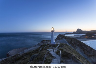 Castle Point Lighthouse/ the lighthouse at Castlepoint, Wairarapa New Zealand, shot at dusk as the lighthouse light comes on