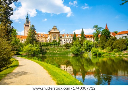 Castle with reflection in pond in spring time, Pruhonice, Czech Republic