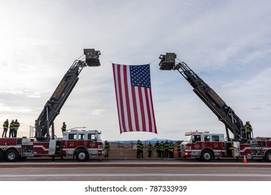 CASTLE ROCK, COLORADO/USA - JANUARY 5, 2018: South Metro Fire And Rescue Hoist The American Flag In Tribute To The Funeral Procession On Interstate-25 For Douglas County Deputy Sheriff Zackari Parrish