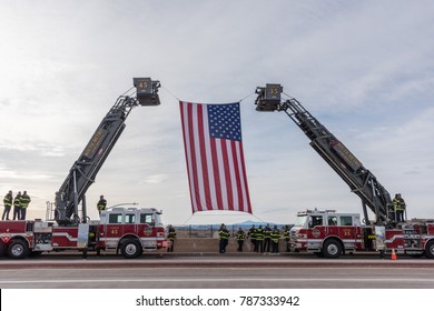 CASTLE ROCK, COLORADO/USA - JANUARY 5, 2018: South Metro Fire And Rescue Hoist The American Flag In Tribute To The Funeral Procession For For For Douglas County Deputy Sheriff Zackari Parrish