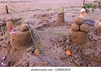 A Castle Of Sand With Towers And Moat.