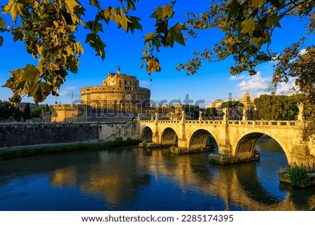 Castle Sant Angelo (Mausoleum of Hadrian), bridge Sant Angelo and river Tiber in the rays of sunset in Roma, Italy. Rome architecture and landmark. Rome cityscape.