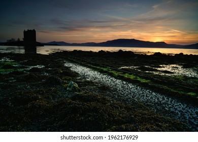 Castle Stalker Silhouette At Sunset, Located In The Highlands Of Scotland.