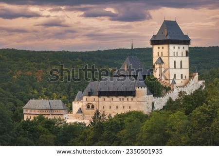 The Karlštejn Castle at sunset with dramatic sky