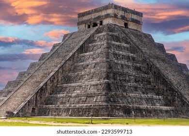 The castle and temple of Chichen Itza known as the famous Mayan pyramid of Mexico under an apocalyptic orange sky, belonging to the Mayan culture and civilization. Travel concept.