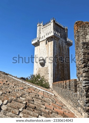 castle tower in beja, portugal (medieval european palace detail with stone wall crenellations, lantern) travel tourism sightseeing