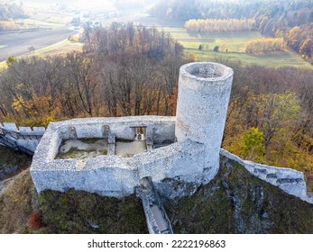 The castle tower as seen from above. Bird's eye view, drone photo. Building, ruins, forest, autumn.