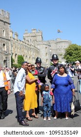 Castle, Windsor, Uk, 5/19/2018 : Crowd Scenes After Wedding Of Meghan Markle And Prince Harry Police Pose With Tourists At Windsor Castle. Stock, Photo, Photograph, Picture, Image