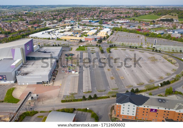 Castleford UK, 24 April 2020: Aerial photo  of\
the Xscape Yorkshire Leisure complex in the village of Castleford\
in Wakefield UK showing an empty car park due to social isolation\
and the UK lockdown