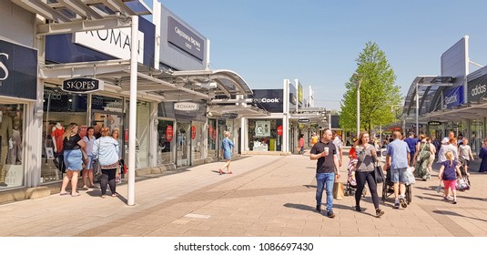 CASTLEFORD, UK - MAY 7 2018: Shoppers Enjoying Spring Bank Holiday At The Outlet Village, Junction 32, Castleford, West Yorkshire, UK