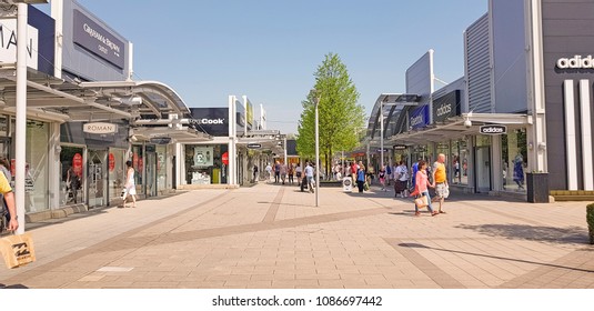 CASTLEFORD, UK - MAY 7 2018: Shoppers Enjoying Spring Bank Holiday At The Outlet Village, Junction 32, Castleford, West Yorkshire, UK