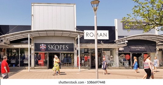 CASTLEFORD, UK - MAY 7 2018: Shoppers Enjoying Spring Bank Holiday At The Outlet Village, Junction 32, Castleford, West Yorkshire, UK