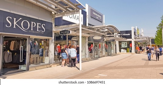 CASTLEFORD, UK - MAY 7 2018: Shoppers Enjoying Spring Bank Holiday At The Outlet Village, Junction 32, Castleford, West Yorkshire, UK