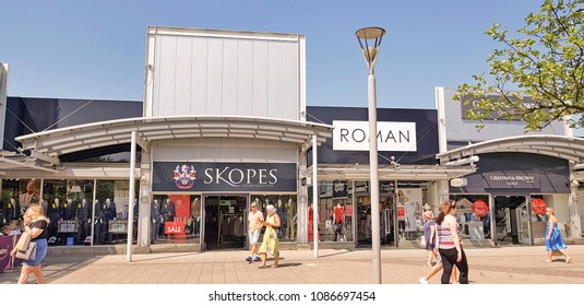 CASTLEFORD, UK - MAY 7 2018: Shoppers Enjoying Spring Bank Holiday At The Outlet Village, Junction 32, Castleford, West Yorkshire, UK