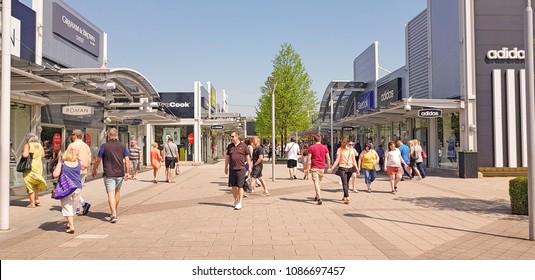 CASTLEFORD, UK - MAY 7 2018: Shoppers Enjoying Spring Bank Holiday At The Outlet Village, Junction 32, Castleford, West Yorkshire, UK