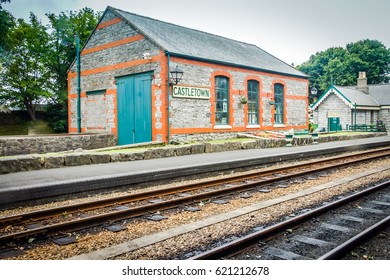 Castletown, Isle Of Man,6 July,2016:Train Station Platform With Train Tracks.Railway Building Train Station Platform Background.Railway Station With Steel Train Tracks.Isle Of Man Public Rail Platform