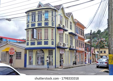 Castries,St Lucia-January 28, 2014: Saint Lucia City Street With Community And Local Businesses. Big Yellow Traditional Building House. Caribbean Island.