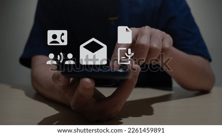 Casual business man, freelancer using mobile phone and online working on laptop computer on table, searching the information, internet networking at home office, close up. ngecek hp