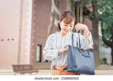 Casual Business Office Worker Looking Inside Bag