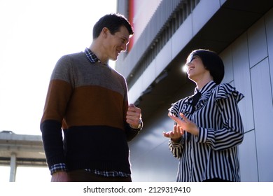 Casual Business People Outside, Man And Woman,  Walking And Talking About Business