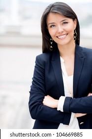 Casual Business Woman With Arms Crossed And Smiling