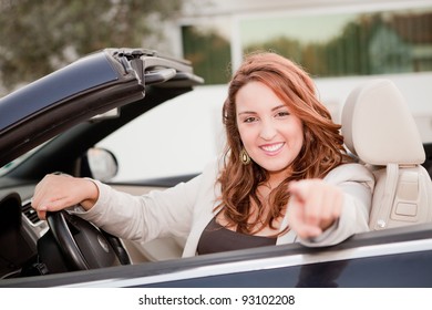 Casual business woman smiling on a car - Shutterstock ID 93102208