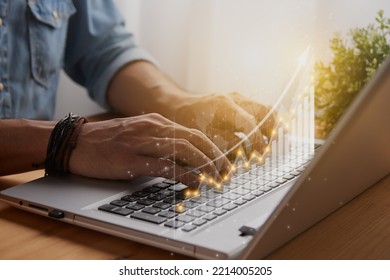 Casual Businessman Hand Using and Typing Laptop Computer with Stock or Forex Market Bar Chart and Line Graph, Arrow Trend and World Map. Financial Economy and Business Growth Concept - Powered by Shutterstock