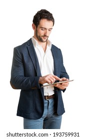 Casual Businessman Looking At A Tablet, Isolated In White