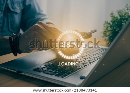 Casual Businessman Touching Mobile Phone or Smart Phone and Circle Loading Module and Laptop Computer. Searching or Downloading Concept in Vintage Tone