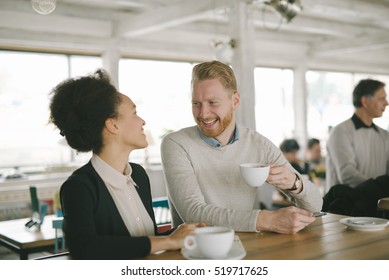 Casual couple having coffee together at the coffee shop - Shutterstock ID 519717625