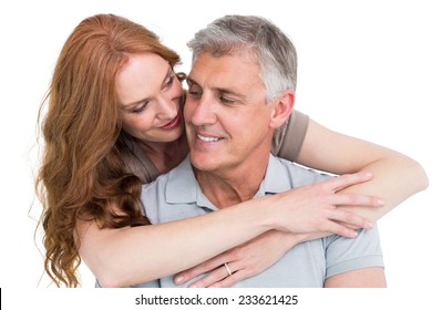 Casual Couple Hugging And Smiling On White Background