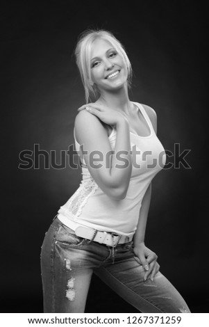 casual cute blonde woman wearing jeans and white top
