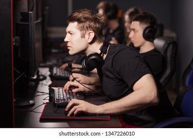 Casual gamers and hardcore fans are gather together in pc gaming club to compete in playing MMO Games online Tournament
