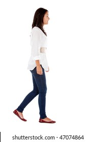 Casual girl walking isolated over a white background - side view