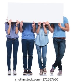Casual Group Of People Hiding Their Faces Behind A Blank Banner On White Background