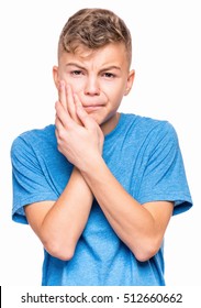 Casual Guy Have Toothache, Isolated On White Background. Emotional Portrait Of Teen Boy Wearing Blue T-shirt. Sad Child With Tooth Pain. Dental Problem - Teenager Suffering From Toothache.