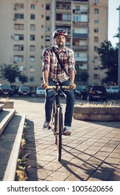 Casual Handsome Businessman With A Helmet Going To Work By Bicycle.