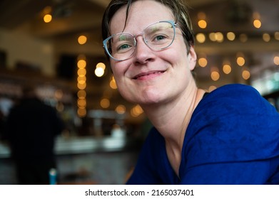 Casual Head And Shoulders Portrait Of A 35 Year Old White Woman Indoors